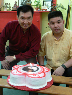 Grandmaster and Tai Sifu pose with the cake for GM's 60th birthday celebration